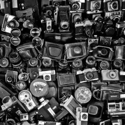 a pile of cameras