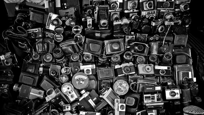 a pile of cameras
