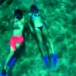 couple, snorkelling, snorkelling couple, underwater couple, mask and tuba, blue, pink, caribbean