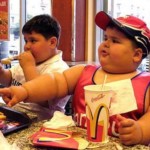 a fat kid eating mc donalds